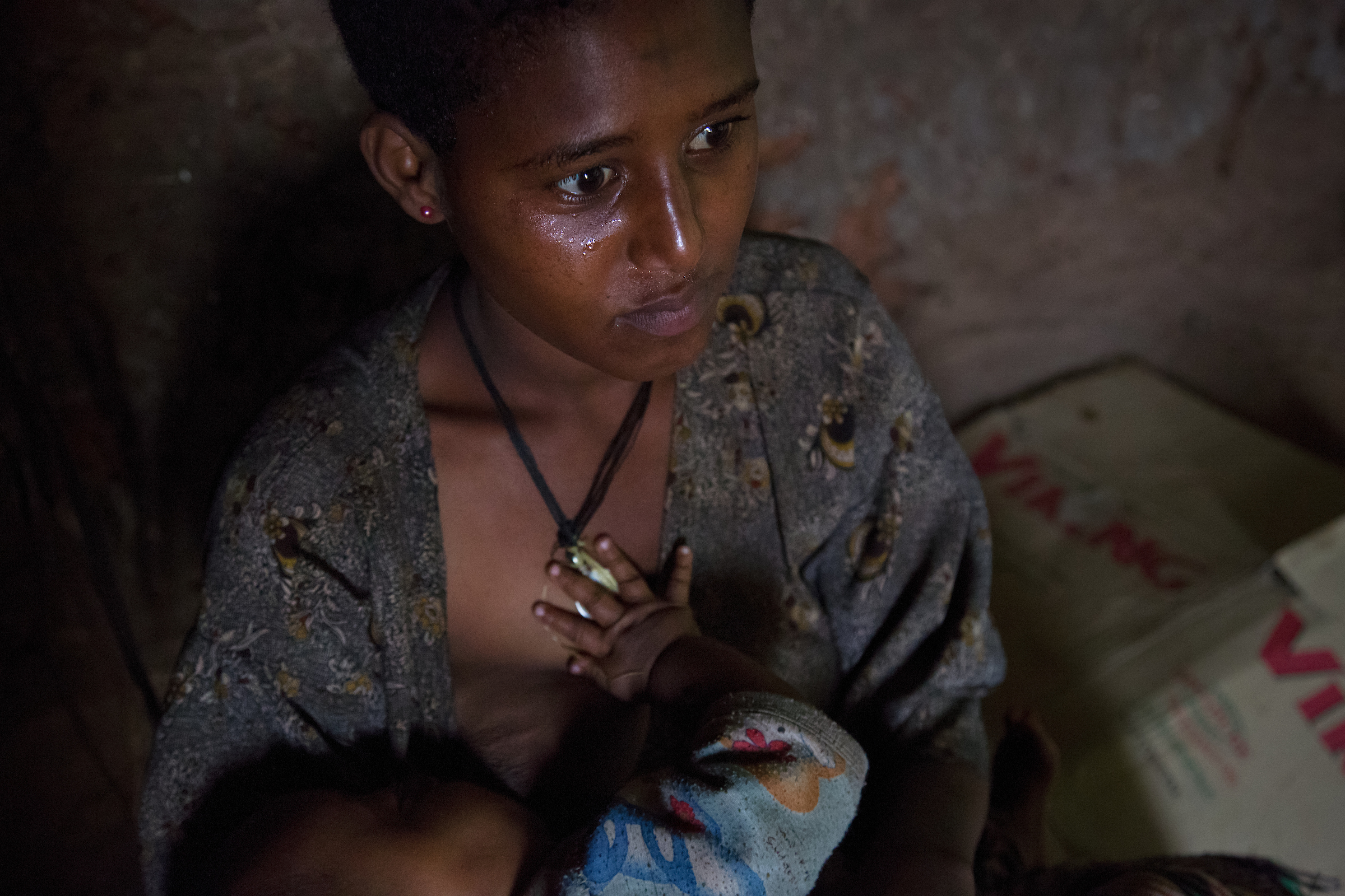 Fifteen-year- old Destaye breastfeeds her son inside her home. Girls married at such young ages rarely have any say in family planning.