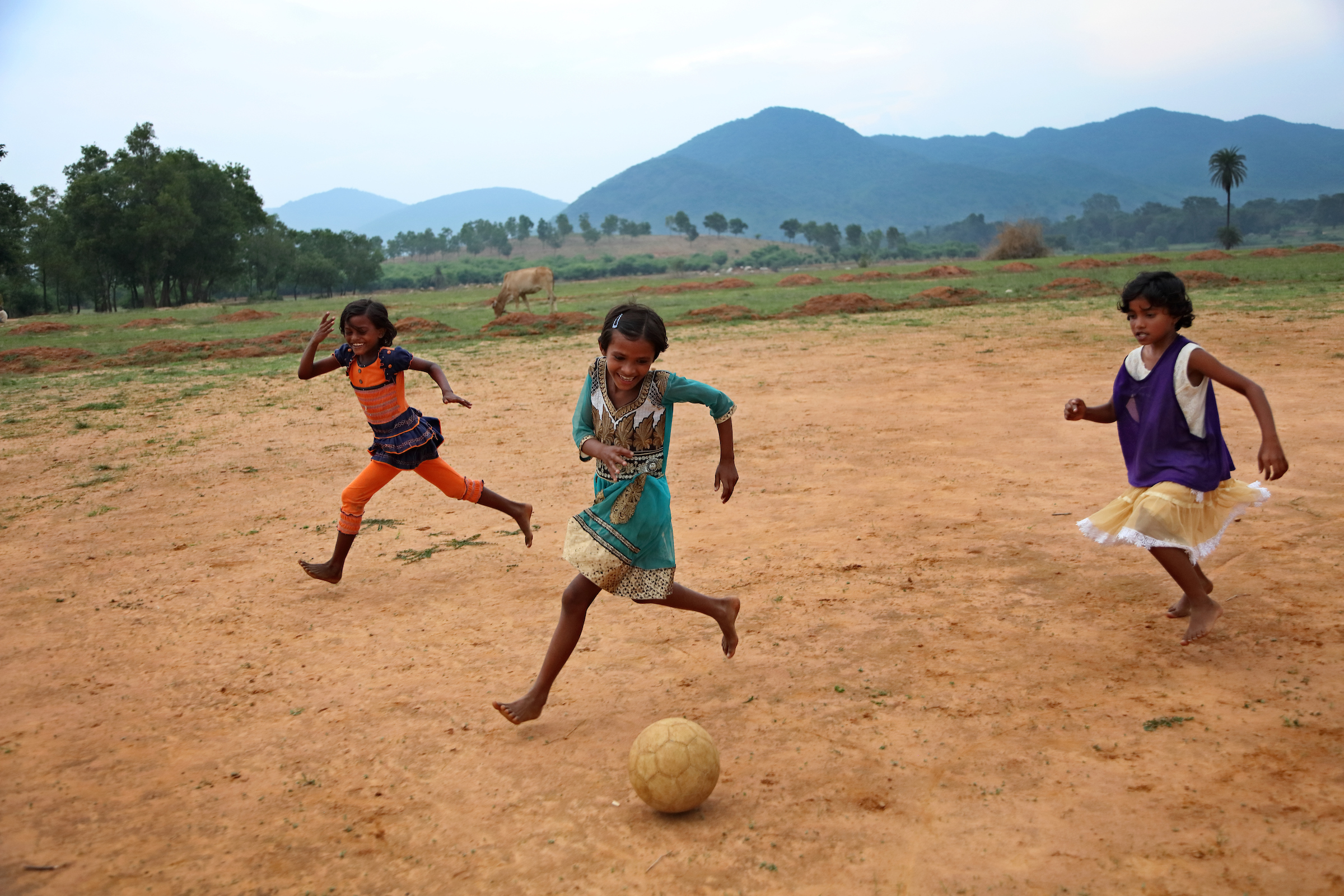 Girls enthusiastically participate in football practice after school as part of a program created by the nonprofit organization Yuwa India in Jharkhand